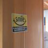 "Smile" sign hanging on Amanda's bedroom door